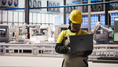 vertical video smiling smart factory specialist testing automated systems to ensure reliability