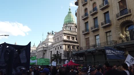 crowd of argentinian people march at national buenos aires congress for public university funds, gathering of urban protestors