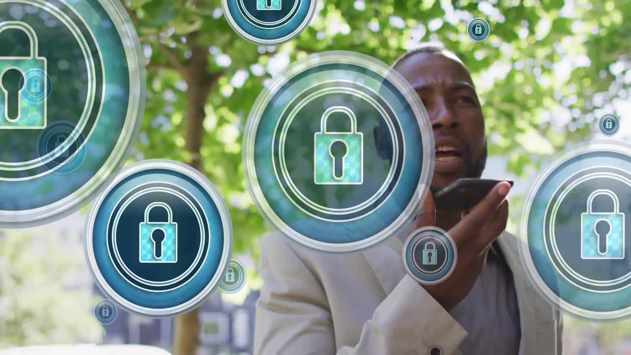 Animação de ícones de cadeado sobre homem afro-americano falando ao smartphone na cidade