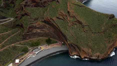 praia do garajau and cristo rei statue in garajau, madeira near canico townscape in portugal