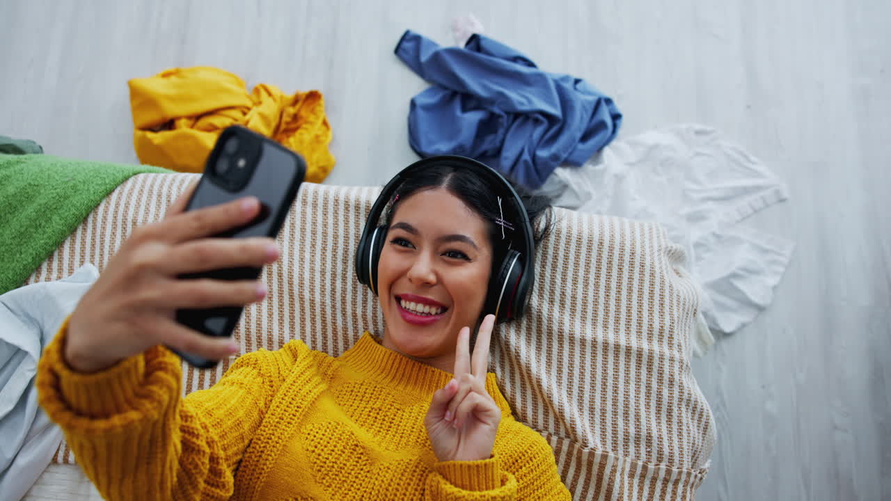 Woman taking selfie with peace sign