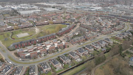 Stunning-aerial-of-suburban-neighbourhood-with-a-green-park-in-the-middle