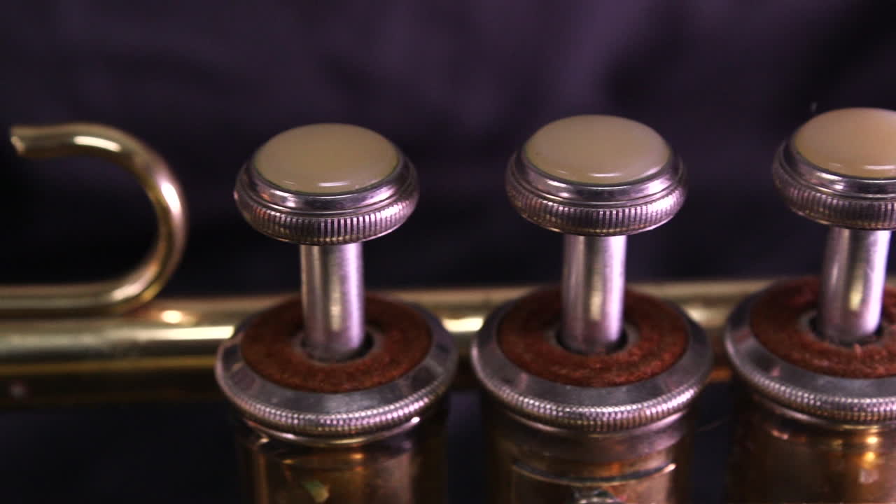 close up slider shot of a brass trumpet.