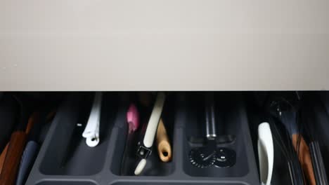 opening a kitchen drawer