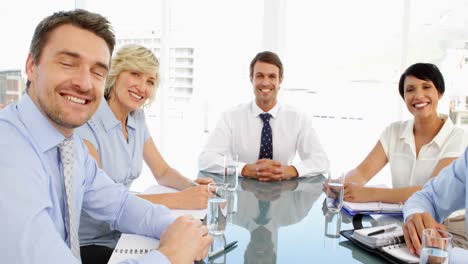 Business-people-shaking-hands-at-a-meeting