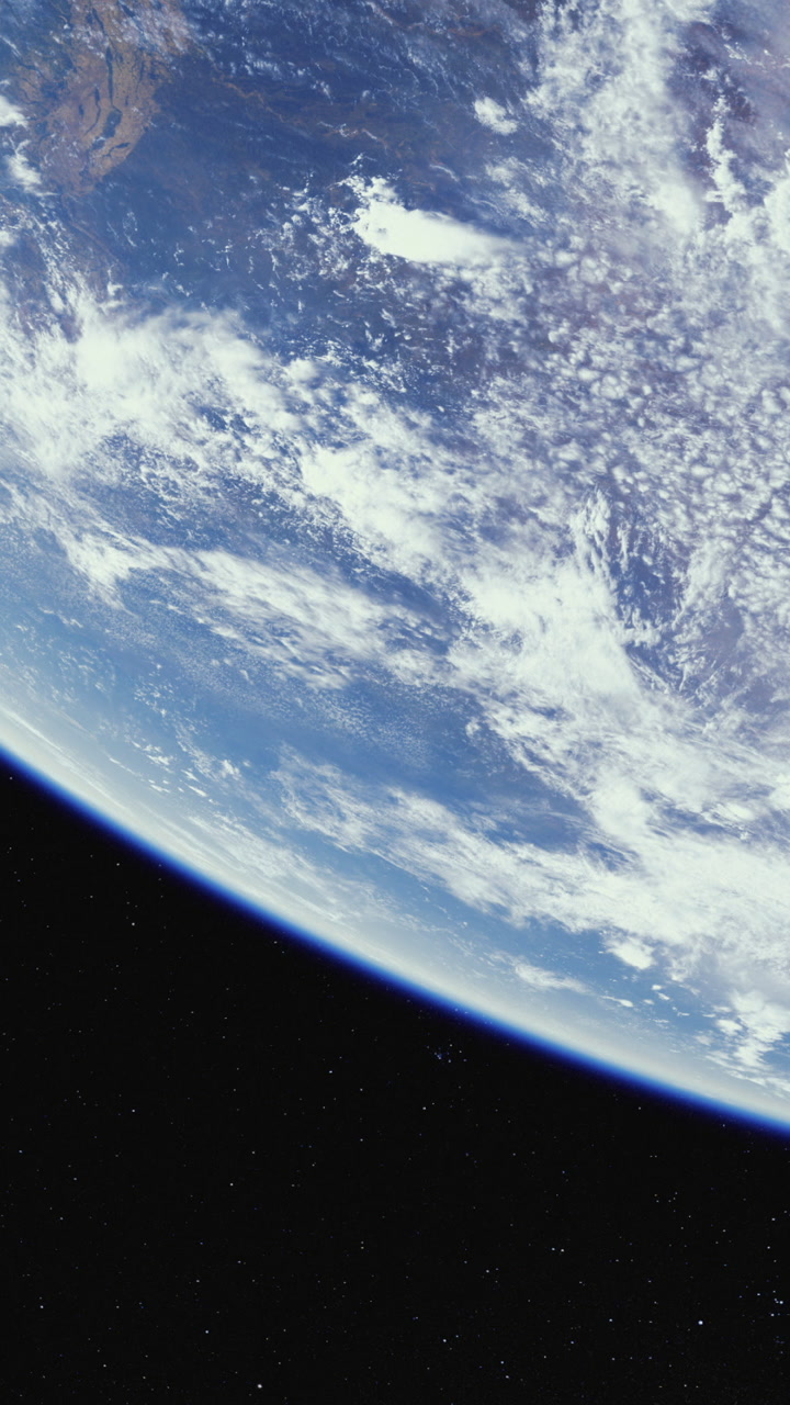 Vast blue planet adorned with swirling clouds captured from space