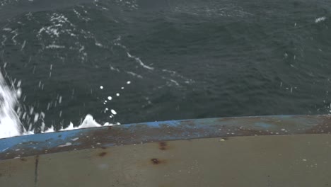 Top-Down-View-Of-Ferry-Boat-With-White-Water-Splashing-Over-Bow,-Tasmania,-Australia