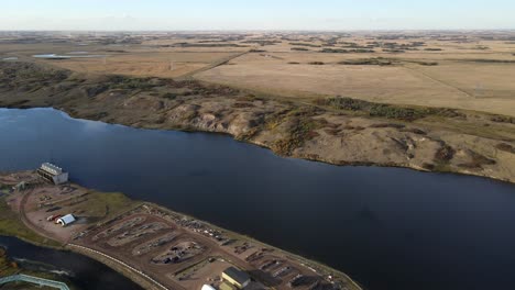 Backwards-reverse-flight-over-north-American-power-plant-in-the-Canadian-prairies