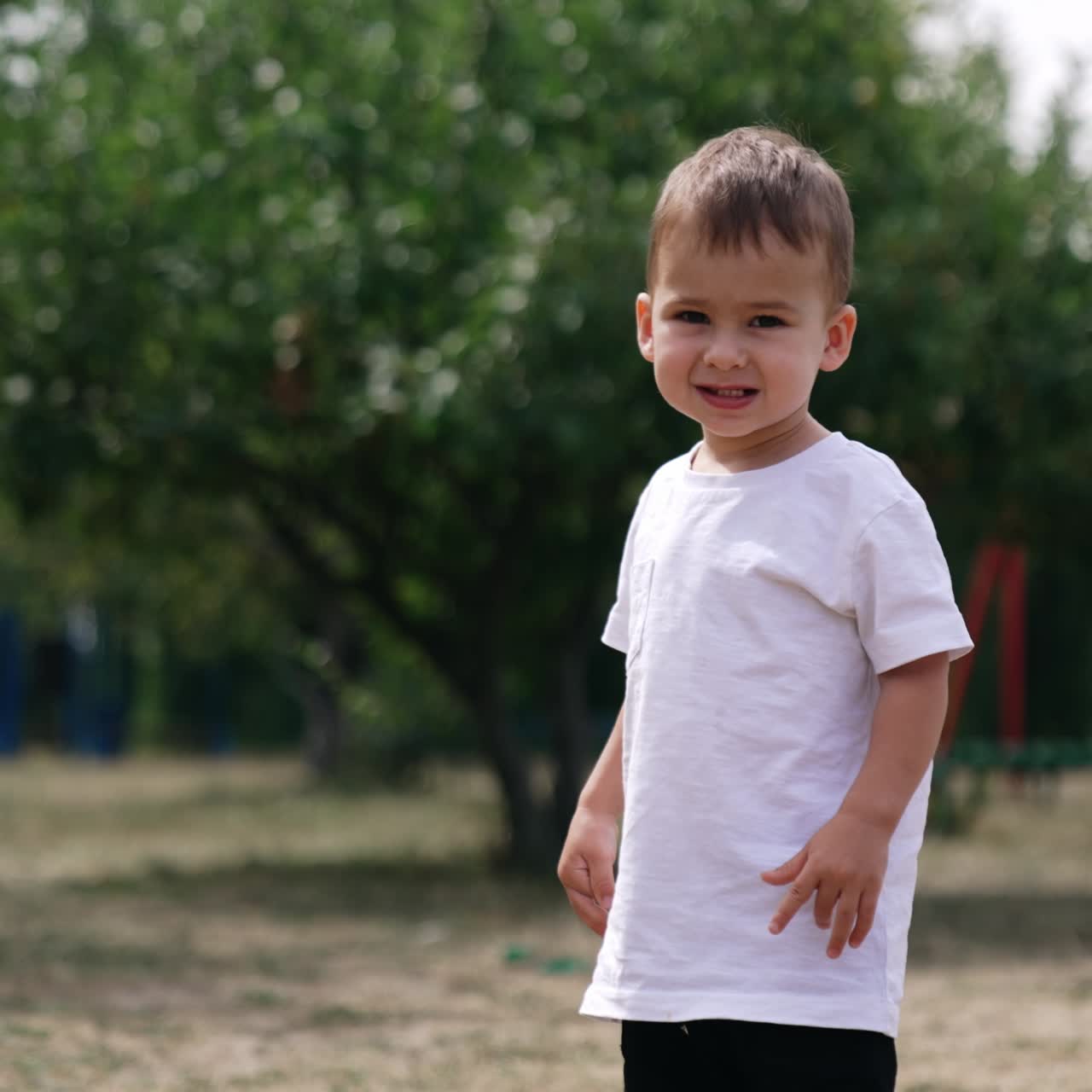 Baby boy playing in the park. Playing outdoor in park small child
