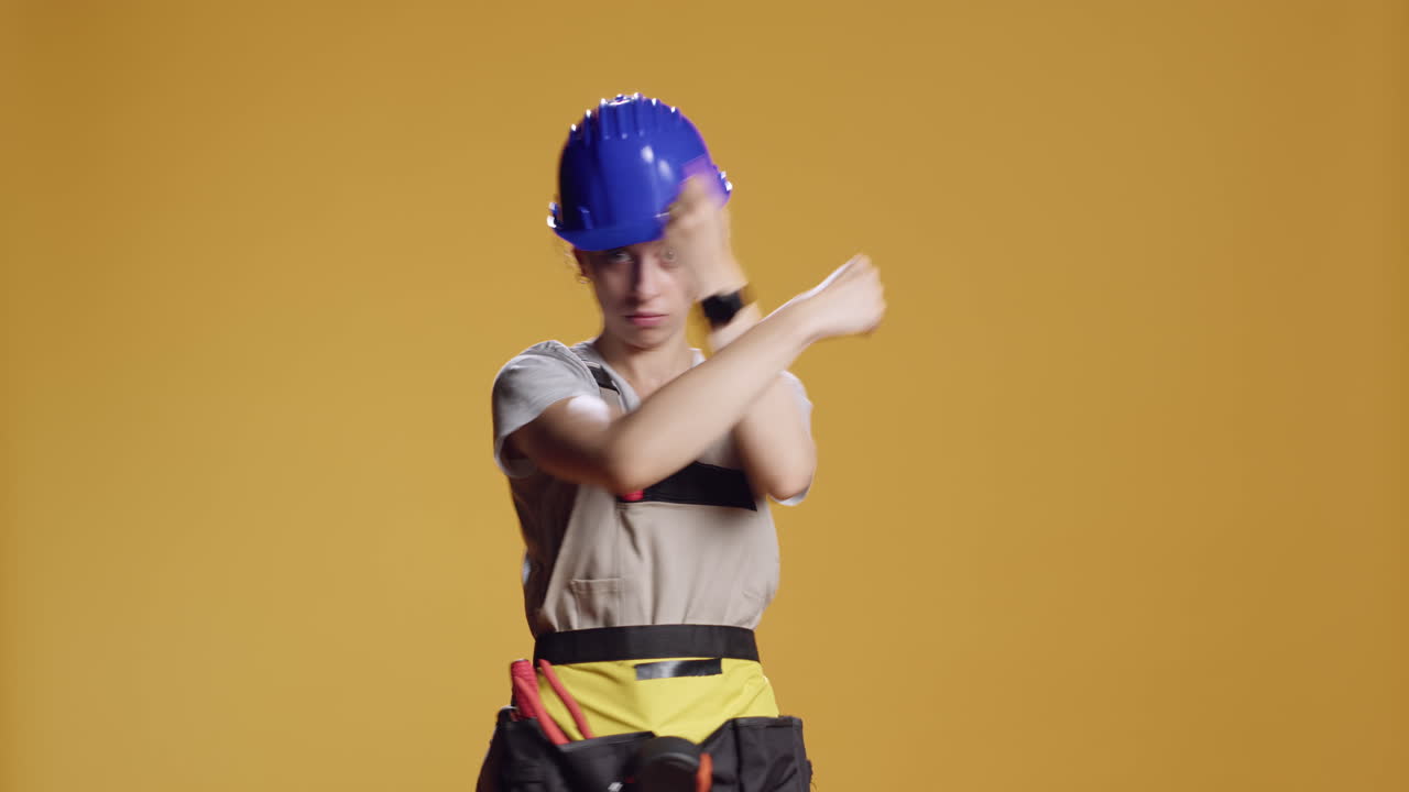 Portrait of strong handywoman doing x shape sign with arms crossed