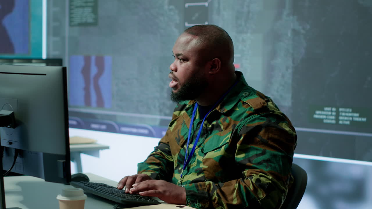 Government intelligence officer in operation room managing surveillance activity