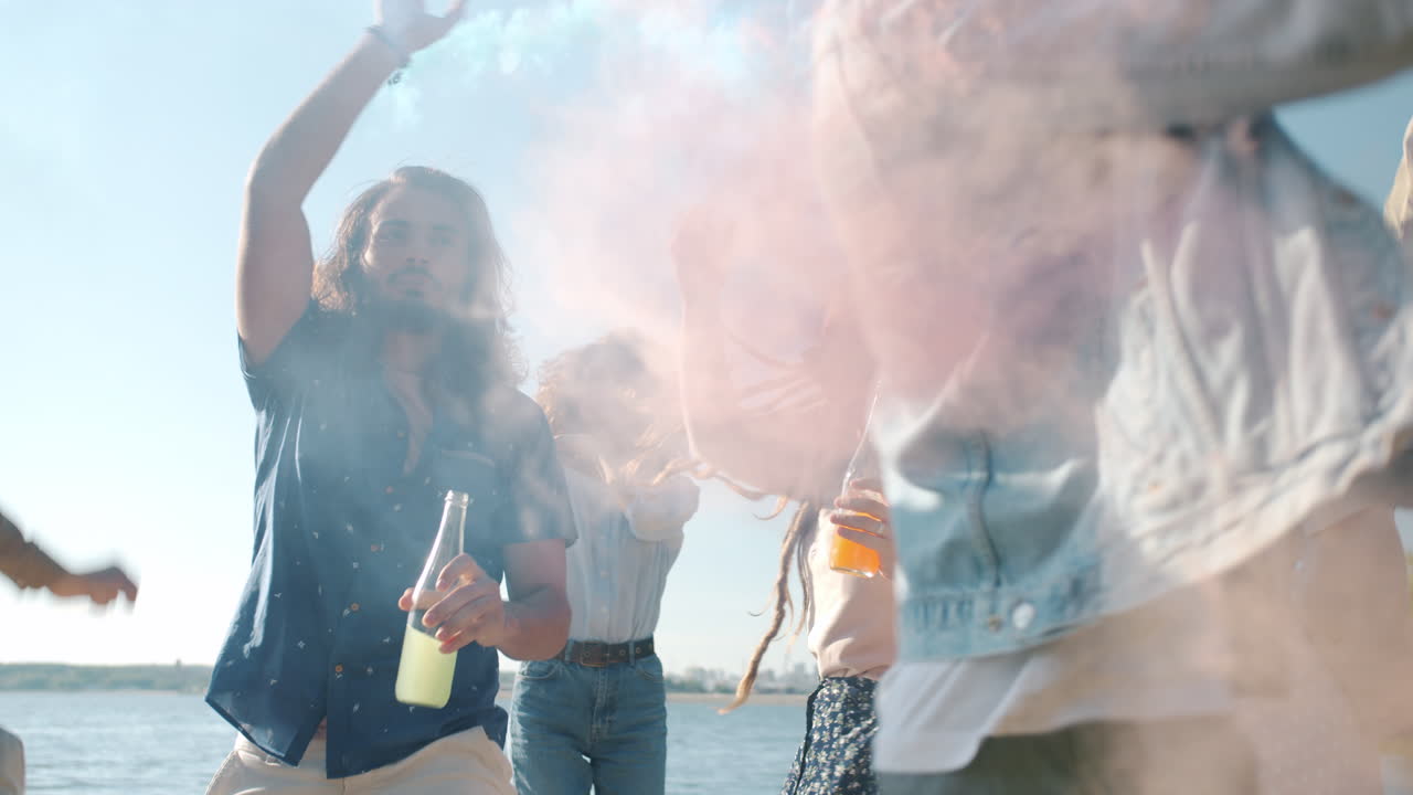 Friends Dancing and Celebrating by the River