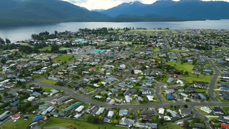 an aerial view of te anau town based near the fjord lake