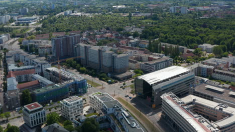 Panorama-curve-shot-of-residential-neighbourhood.-Multilane-road-and-tram-tracks-leading-through-housing-estate