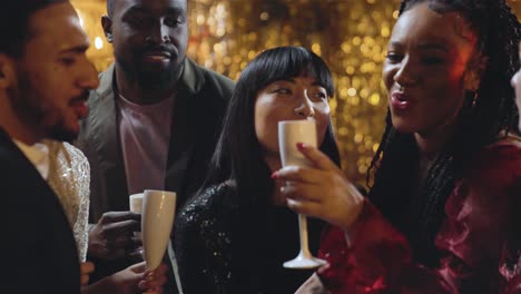 tracking shot approaching woman singing in karaoke bar with her friends