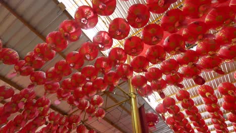 red chinese lanterns hang on roof