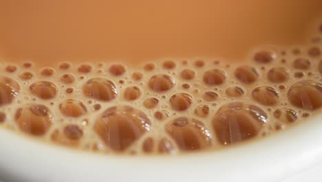 close-up of tea bubbles in a cup