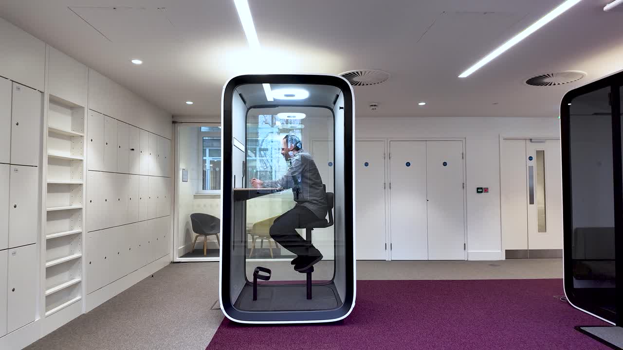 Privacy And Focus In Open Office South Asian Man Enters Soundproof Pod To Take Phone Call Flexible