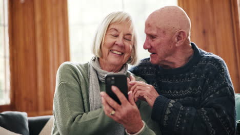 Phone,-laughing-and-senior-couple-on-a-sofa