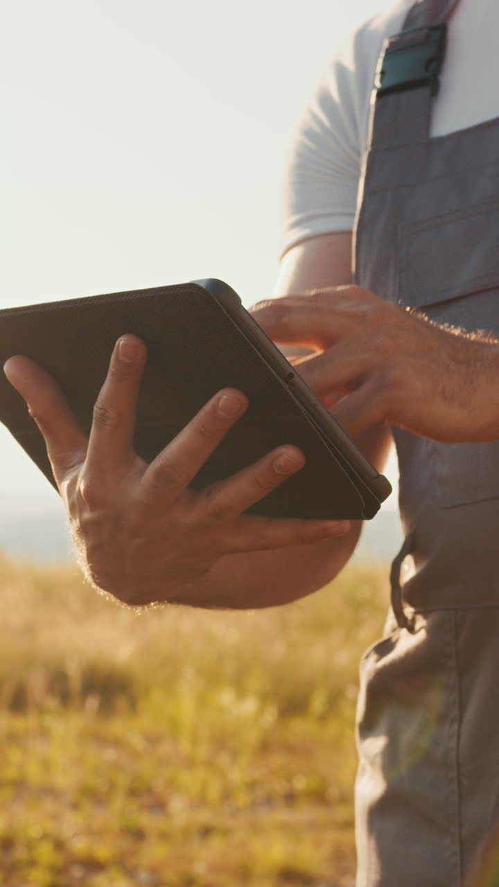 Farmer using tablet in field