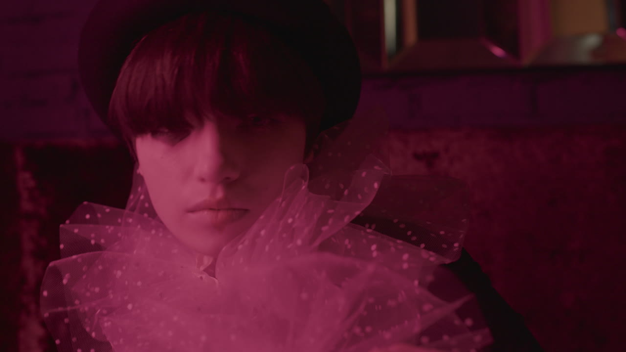 Close-up view of young woman dancing.