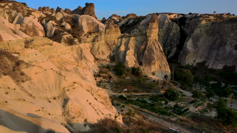 Epic-cinematic-drone-shot-going-through-the-fairy-chimneys-and-ravine-in-Cappadocia,-Turkey