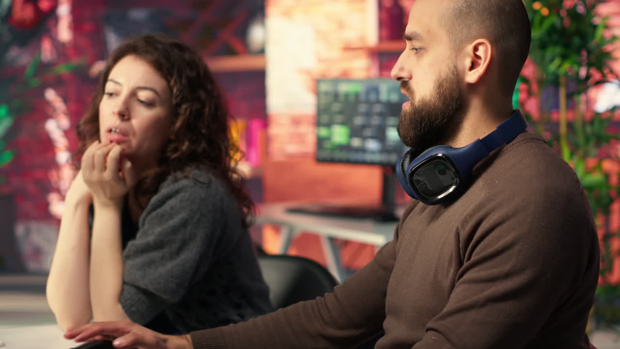 Two developers team interact with virtual AI assistant on PC