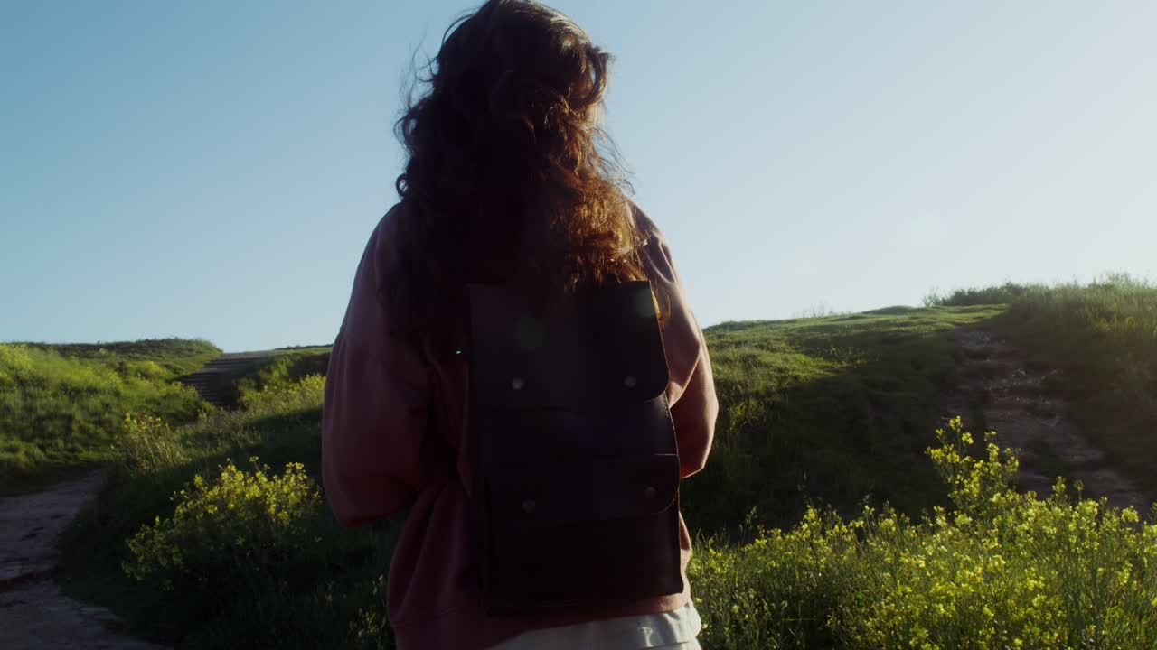 Woman Hiking on a Sunny Path