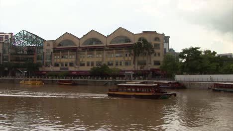 small boats on singapore river