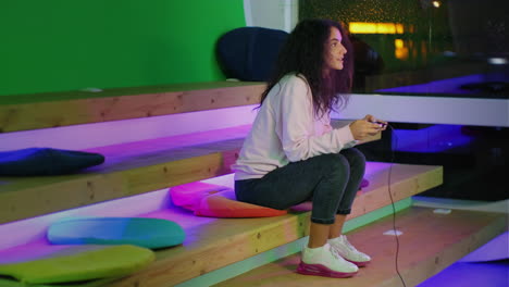 woman playing video games in a modern gaming lounge