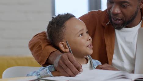 father helping son with homework