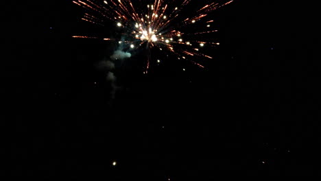 slow motion flight through vibrant fireworks in night sky