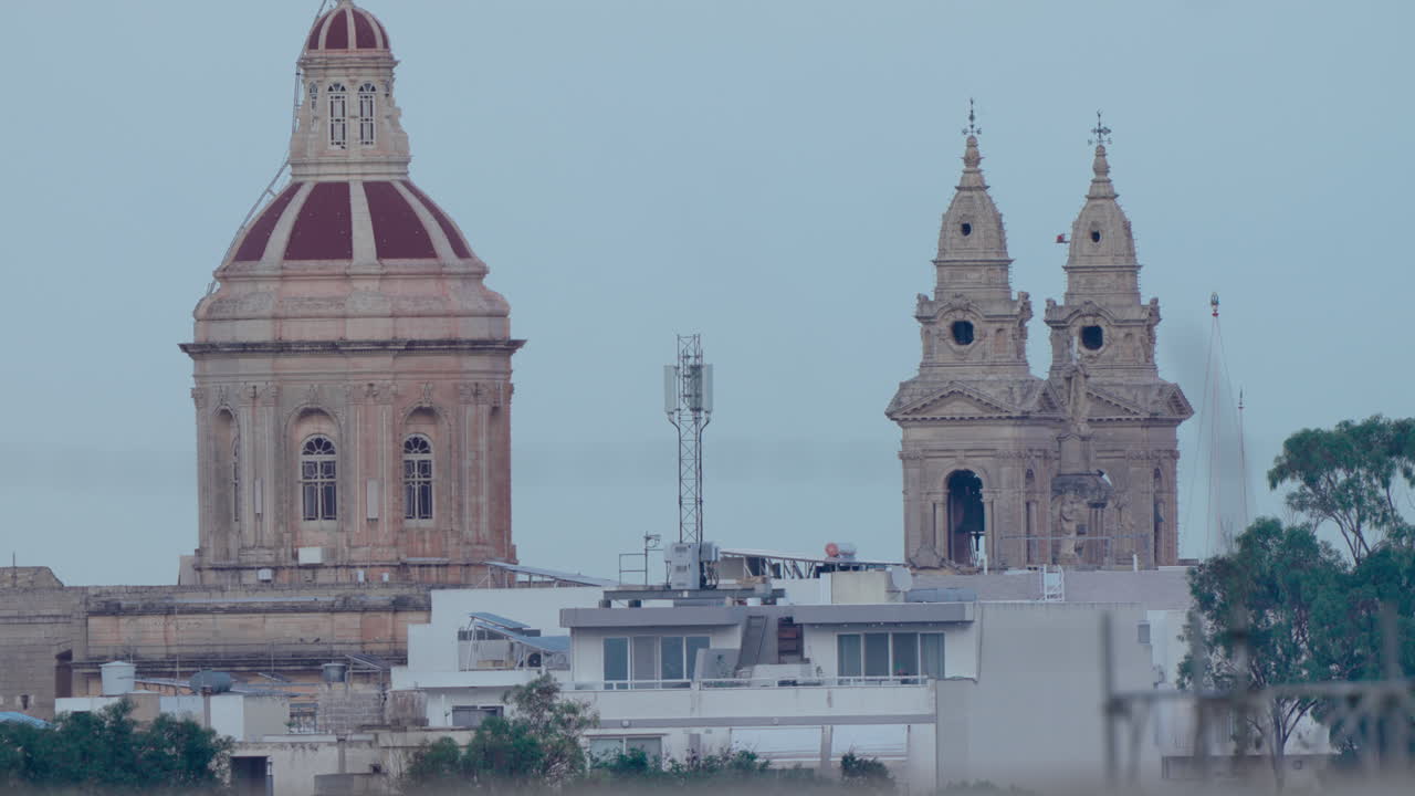 Cityscape featuring cathedrals and buildings in Valletta, Malta