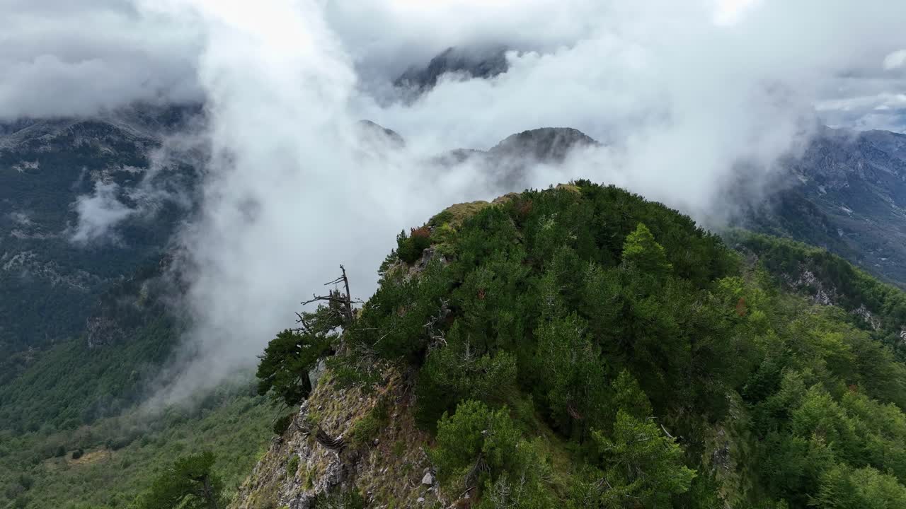 Aerial drone fly above clouds in Theth Albanian mountain landscape