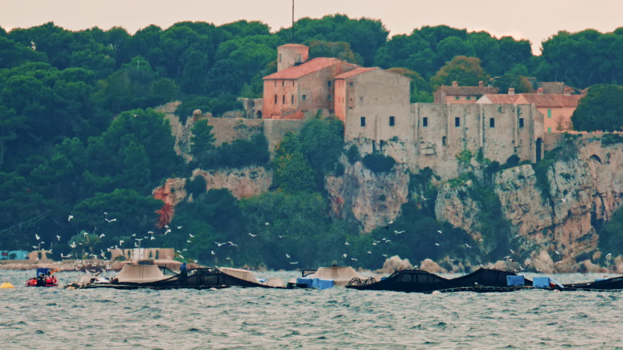 View of a historic stone fortress on a rocky Mediterranean island near Cannes on the French Riviera