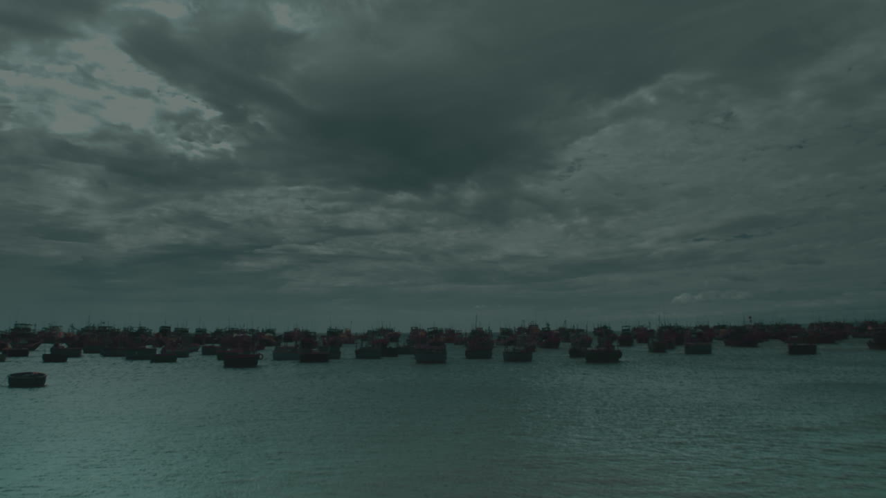 vietnam binh thuan port seascape during a rainy storm day with fisherman boat moored at bay