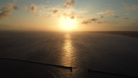 sunset over the ocean from a drone