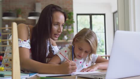 mother helping her daughter with homework in a comfortable home 4k