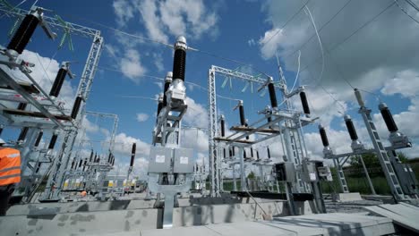 construction of a transformer substation. electrical engineer control wiring electric power on steel tower, electric construction and maintenance services throughout, electric power transmission infrastructure, highest voltage transmission