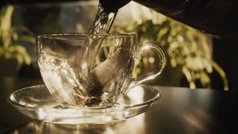 bagged black tea is brewed in a glass cup