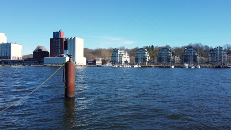harbor cityscape with grain silos and apartments