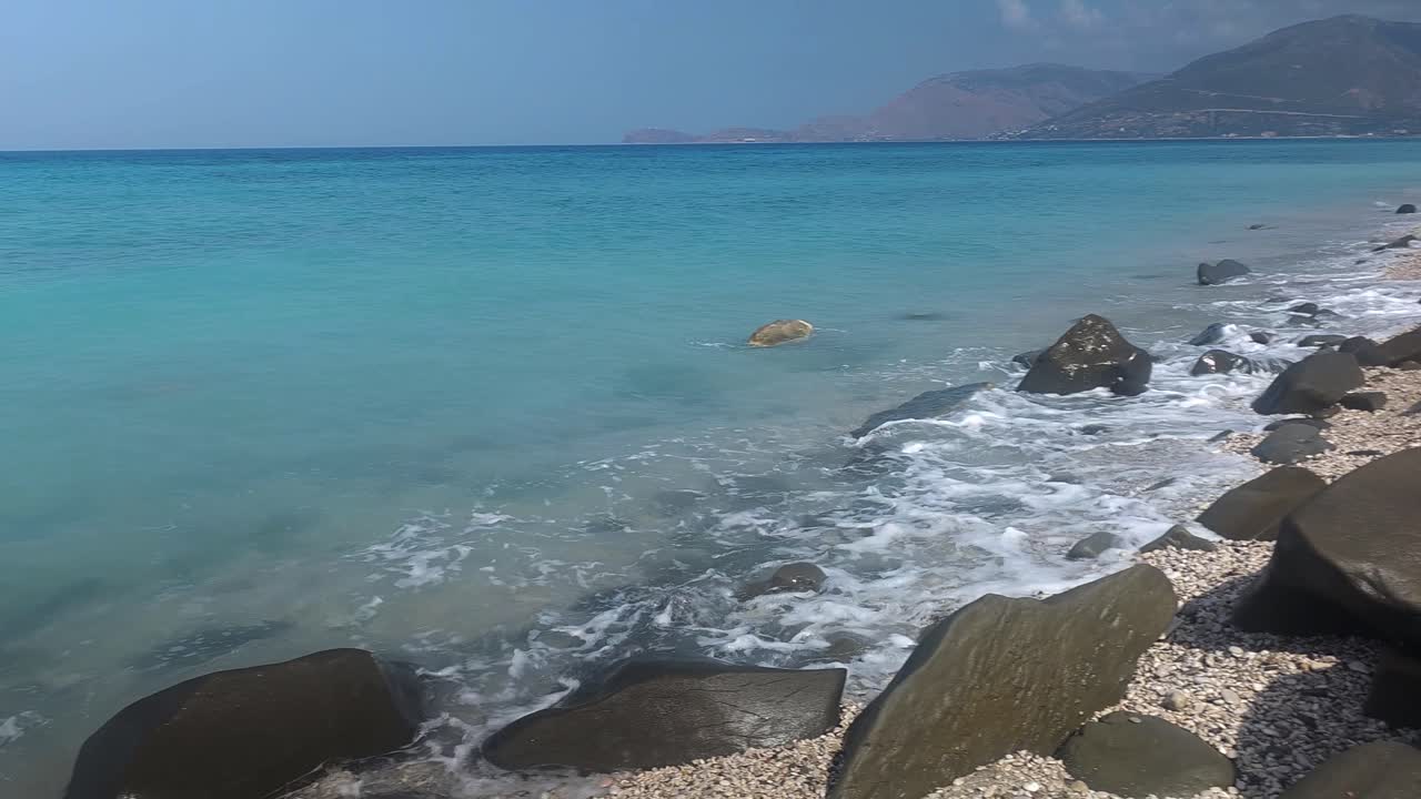 Dreamy Seascape, Gentle White Foaming Waves Caressing Rocky Coastline in a Beautiful Panorama of Blue Turquoise Mediterranean Serenity