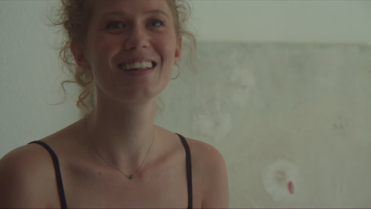 shy young female can't stop laughing being playful and fun
