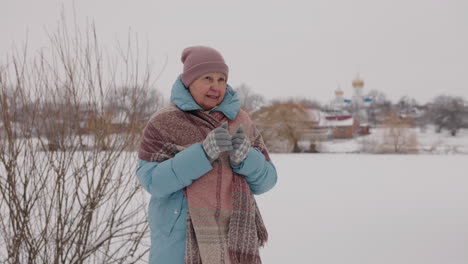 elderly woman in winter landscape