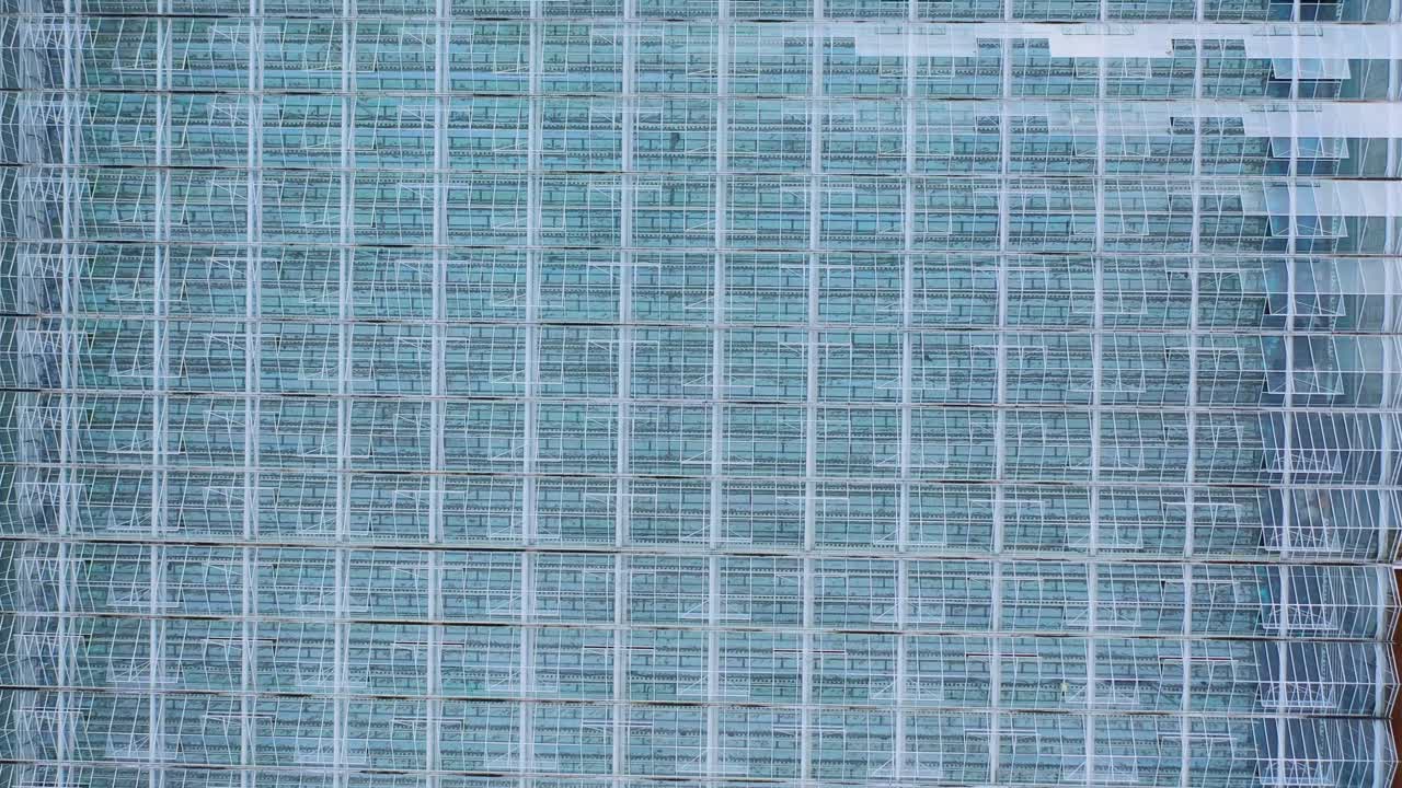 Aerial top view of greenhouse over the glass roof. Indoor farming, heat recovery, power consumption and organic plant protection concept
