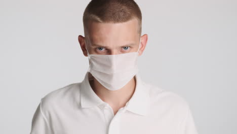 Angry-man-wearing-white-face-mask