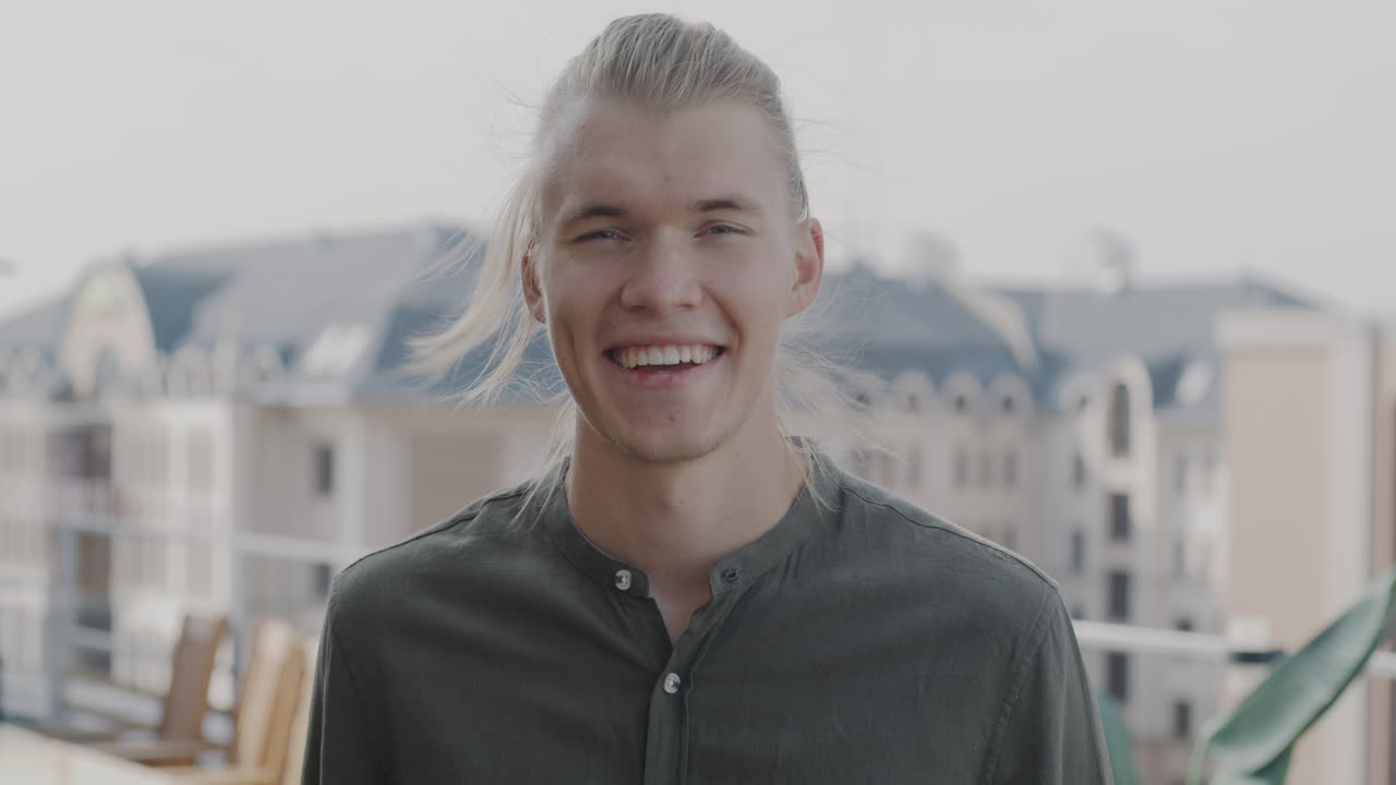 Smiling Man on a Rooftop