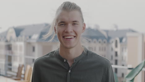 smiling man on a rooftop