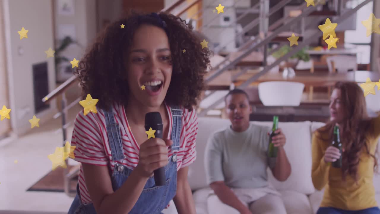 Happy diverse female and male friends singing karaoke and drinking beer at home