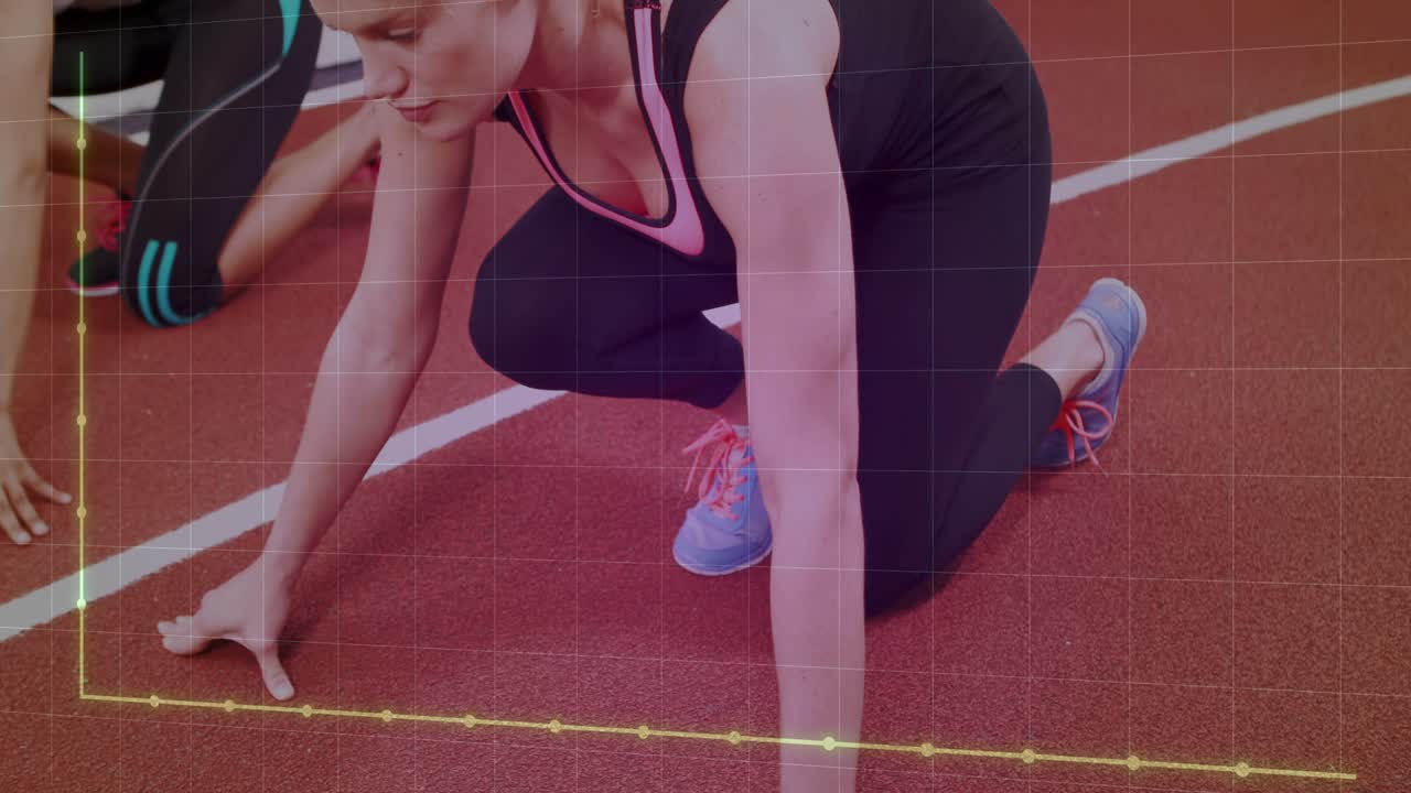 Two women pushing off from low crouch, sprinting down track while training graph tracking steps